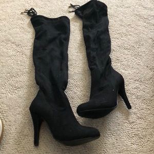 Black thigh high boots. Never been worn.